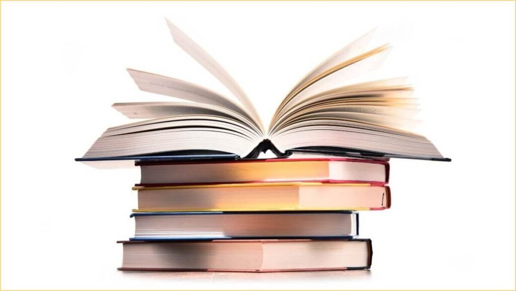 Composition with stack of books isolated on white